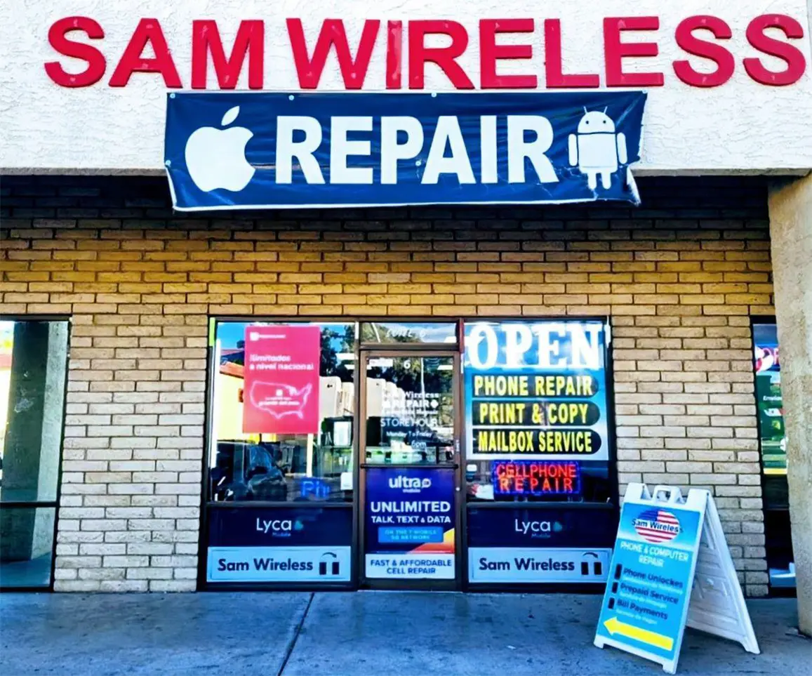Sam Wireless storefront with signs for phone repair, print services, mailbox service, and cell phone plans